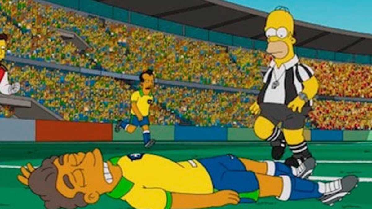 joueur de foot par terre